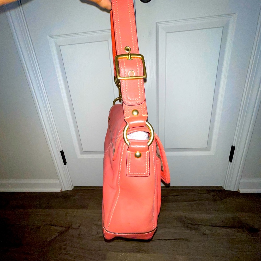 Coral and gold coach shoulder bag. Beautiful gold hardware.